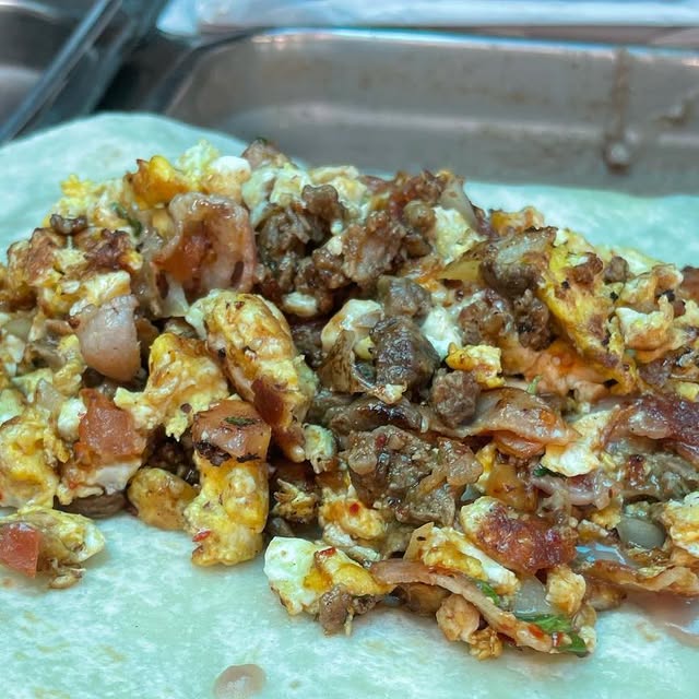 Breakfast burrito with asada and red and green salsa at Danny's Tacos